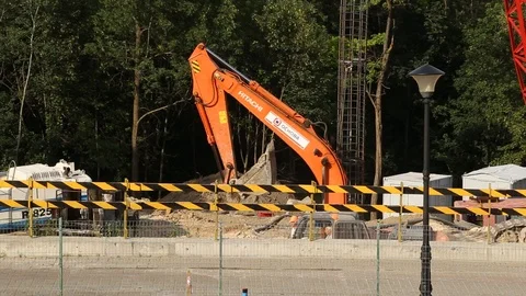 Excavator at a construction site Stock Footage