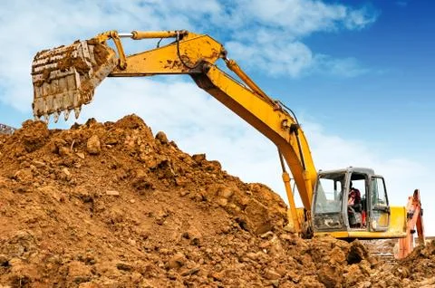 Excavator on the construction site Stock Photos