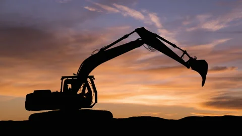 Excavator in construction site on sunset sky background. Timelapse. Stock Footage 165730751