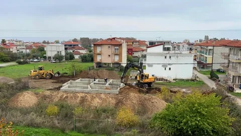Excavator Covering Building Foundation at Construction Site Timelapse Stock Footage 321773642