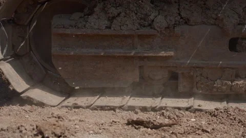 Excavator Crawler Tracks Moving Through Dirt at Construction Site Video stock 347008183