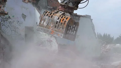 Excavator in demolition work. Heavy machine breaking old building Stock Footage 98515896