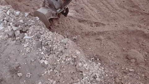 An excavator dig the ground close up Stock Footage 169323989
