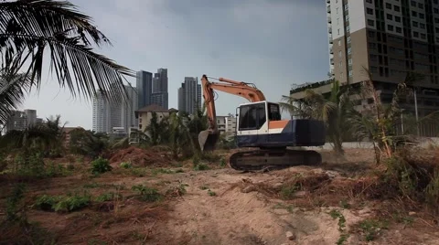Excavator Digger on a construction site equates land clearing a building site Stock Footage 47045060
