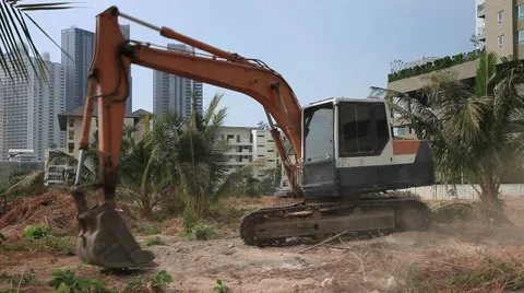 Excavator Digger on a construction site equates land clearing a building site, Stock Footage 47047239
