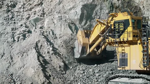 Excavator digger digging limestone in op... | Stock Video | Pond5
