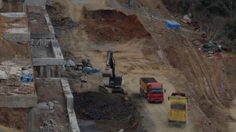 Excavator Digging and Dump Truck on Construction Site Stock Footage 333604045