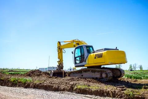 Excavator is digging on building site Stock Photos