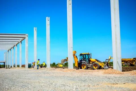 Excavator is digging on building site Stock Photos