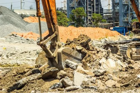 Excavator digging the concret Stock Photos