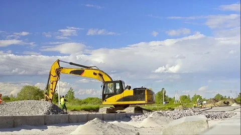 Excavator digging on construction high-speed road Stock Footage