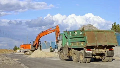 Excavator digging on construction high-speed road Stock Footage 77173734