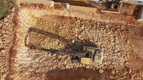 Excavator digging on construction site aerial view Stockbeeldmateriaal 286057901
