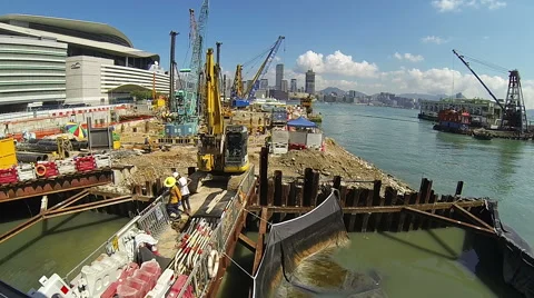 Excavator digging on construction site in the big city. Stock Footage 57324216