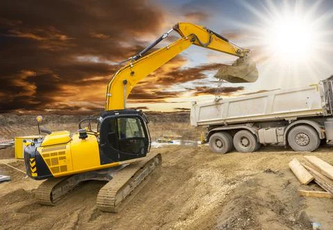 Excavator is digging on construction site Stock Photos
