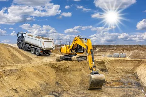 Excavator is digging on construction site Stock Photos