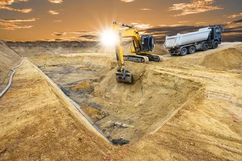 Excavator is digging on construction site Stock Photos