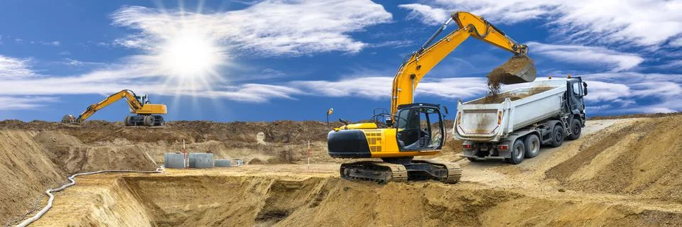 Excavator is digging on construction site Stock Photos