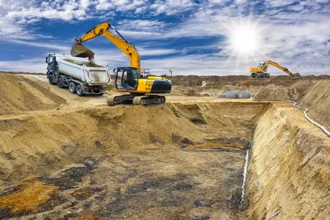 Excavator is digging on construction site Stock Photos