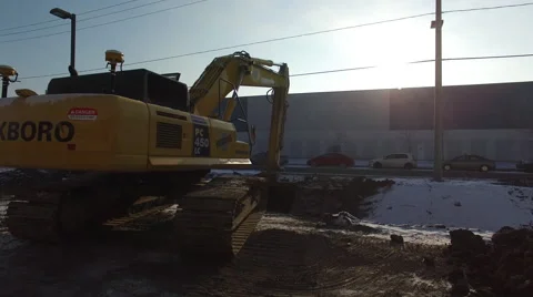 Excavator digging a ditch Stock Footage 64130288