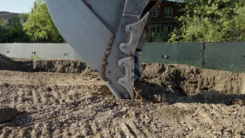 Excavator digging earth in slow motion. excavator bucket work on construction Stock Footage 312172515