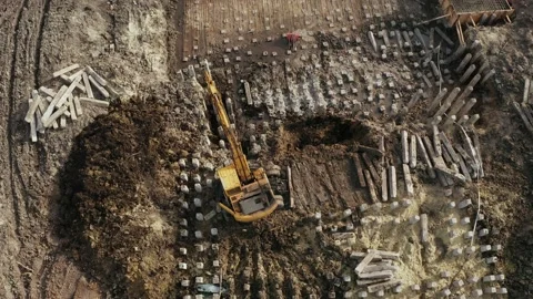 The excavator is digging the foundation of the house. Stock Footage 168873383