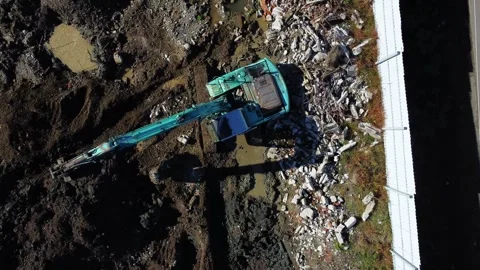 Excavator Digging Foundation Pit - Aerial View. Stock Footage 259394920