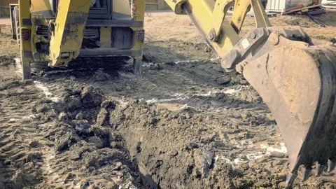 Excavator is digging foundations. Construction machinery, ground works Видео 87346727