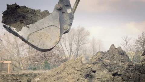 Excavator is digging foundations. Construction machinery, ground works Видео 87418911