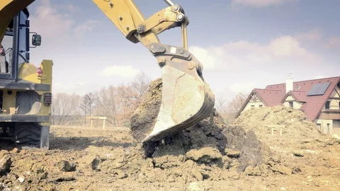Excavator is digging foundations. Construction machinery, ground works Видео 87469845