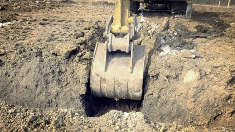 Excavator is digging foundations. Construction machinery, ground works Видео 87470632