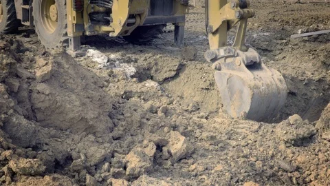 Excavator is digging foundations. Construction machinery, ground works Видео 87470716