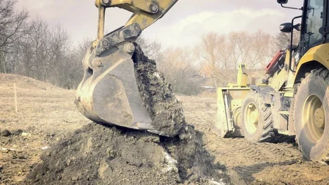 Excavator is digging foundations. Construction machinery, ground works Видео 87776344