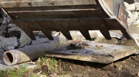Excavator Digging Grass, Dirt and Concrete Rubble Stock Footage 40648238