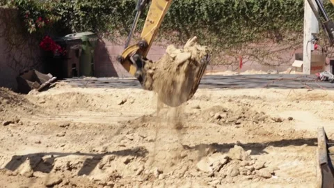 Excavator digging into ground at construction yard Stock-Footage 228794773