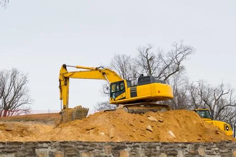 Excavator digging the ground Stock Photos