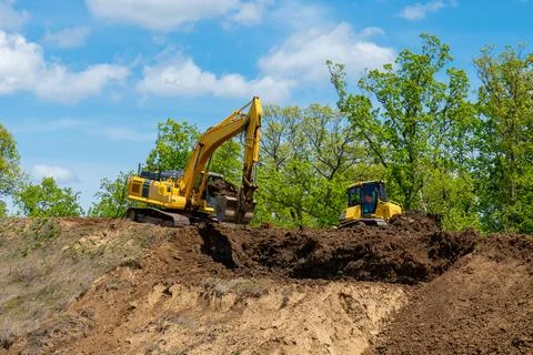 Excavator digging the ground Stock Photos