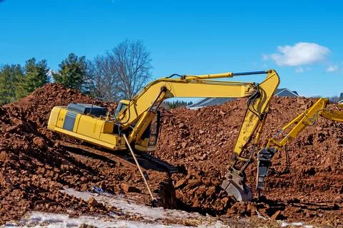 Excavator digging the ground Stock Photos
