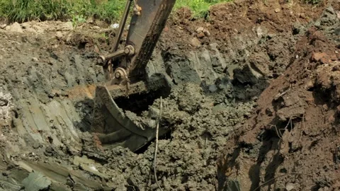 Excavator Digging Hole at Construction Site Close-Up of Bucket Action. Stock Footage 292520971