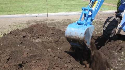 Excavator digging a hole Stock Footage 54080198