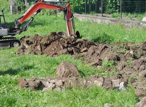 Excavator digging a hole Foto stock