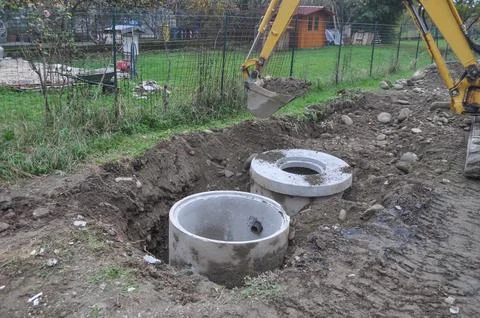 Excavator digging a hole Stock Photos