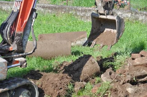 Excavator digging a hole Stock Photos