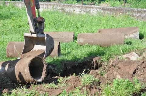 Excavator digging a hole Stock Photos