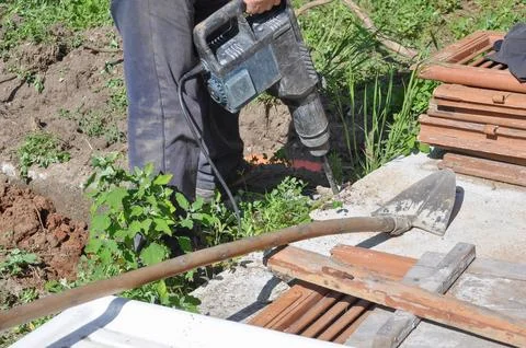 Excavator digging a hole Stock-Fotos