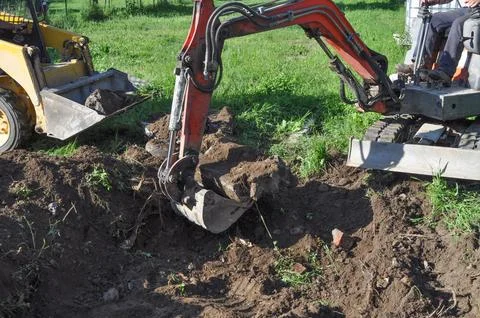 Excavator digging a hole Foto stock
