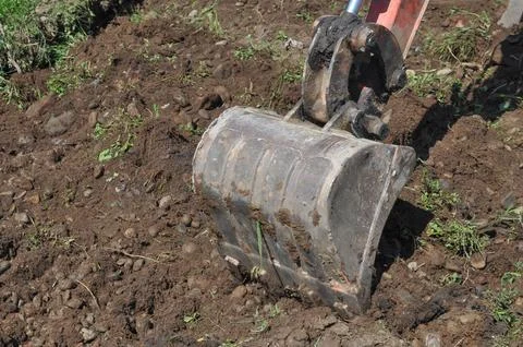 Excavator digging a hole Stock Photos
