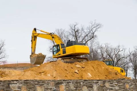 Excavator digging in a quarry Stock Photos