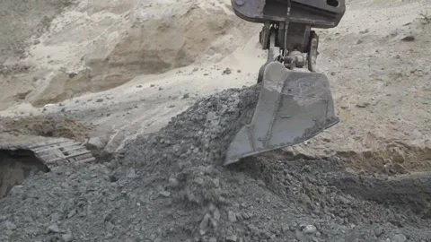 Excavator digging soil with a bucket Stock Footage 285134488