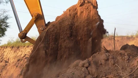 Excavator Digging Soil in Construction Site Close-Up Stock Footage 333070032